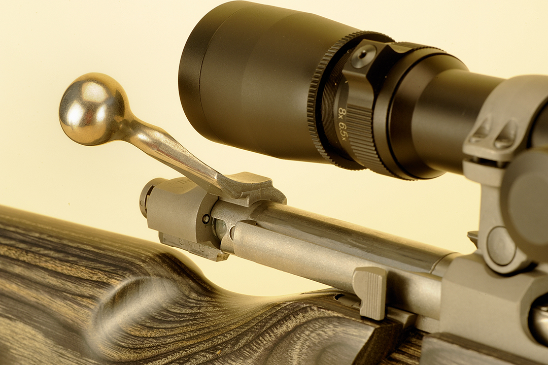 Over the years, gun manufacturers have made it a point to make a bolt handle with plenty of clearance for the scopes today with a larger eyepiece. Take note of the concaved portion of the bolt handle between the bolt knob and the bolt itself.
